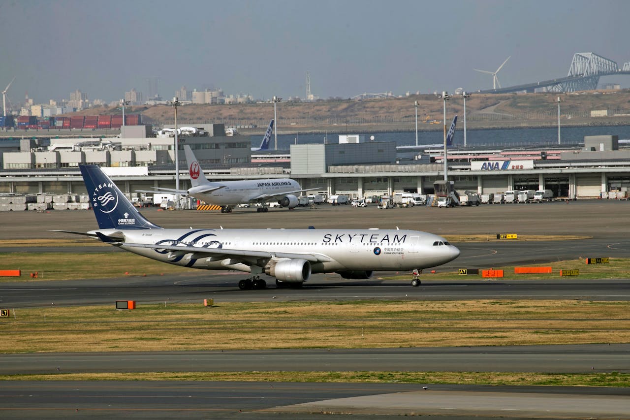 A large passenger jet sitting on the runway